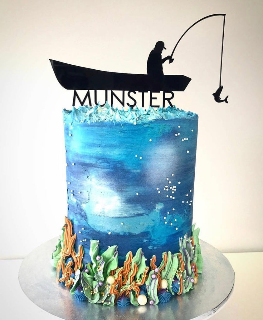 A Man Fishing on a Boat Cake Topper